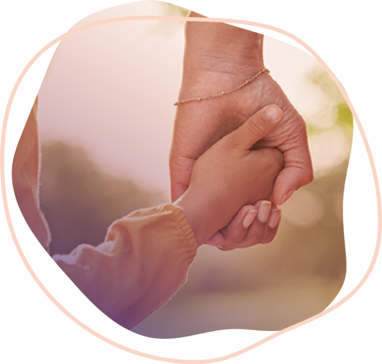A child holding an adult's hand