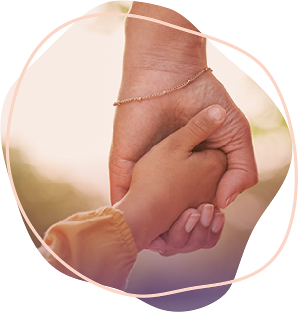 A child holding an adult's hand