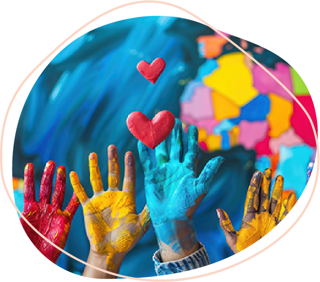 Hands covered in paint outstretched in the air reaching for a heart