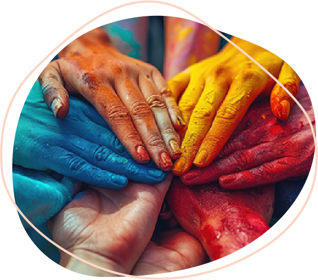 Hands covered in paint overlapping each other