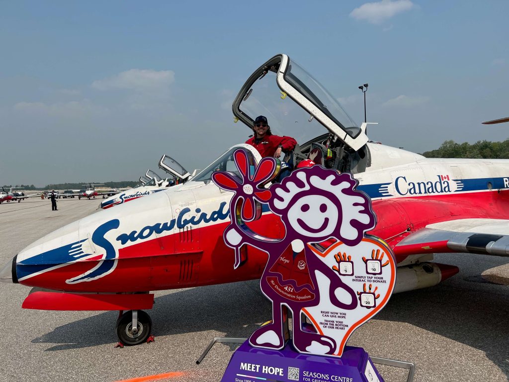 Hope posing in front of a Snowbird